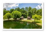our fishing pond and two of our cabins